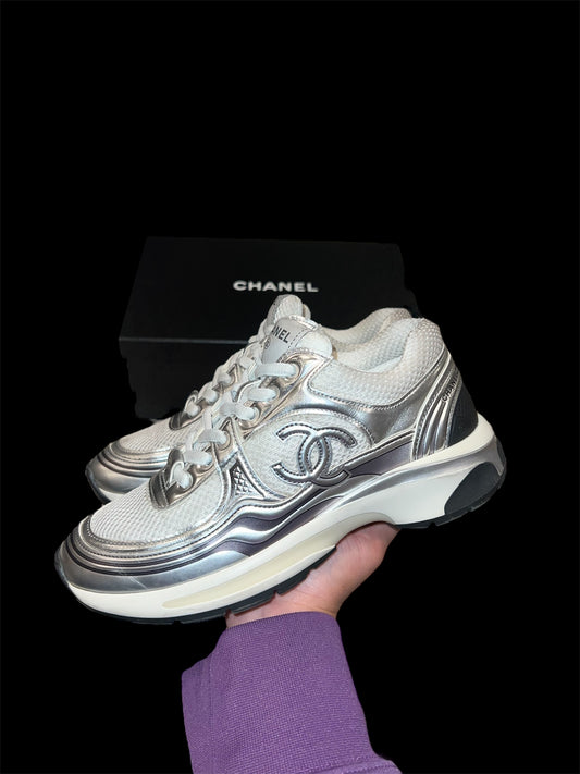 Preowned Silver Chanel Runners size 37 (fits 7W-7.5W)